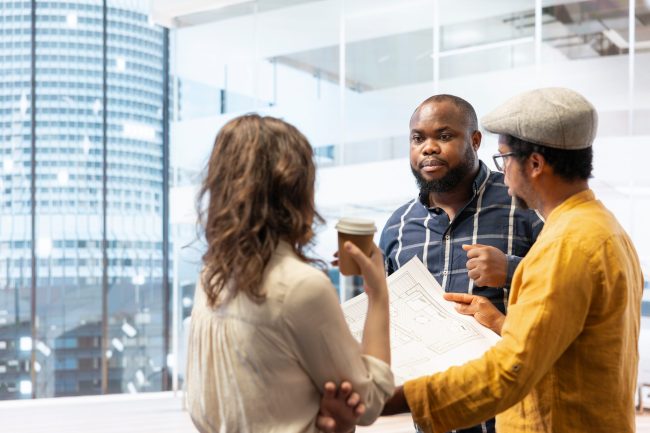 Professionals and realtor planning an urban office space renovation